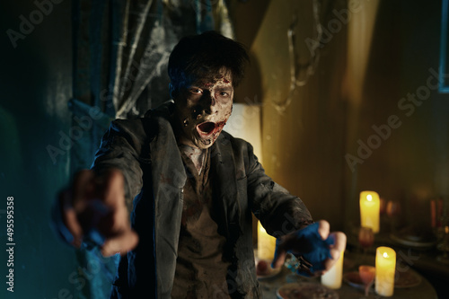 Принти на полотні Portrait of scary bloodthirsty zombie man attack