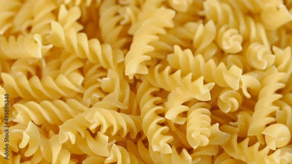 Pasta conchiglie.Pasta for food, rotation. Macaroni - Mini Conchiglie Rigate close up.Shell pasta Pasta conchiglie.Pasta for food, rotation. Macaroni - Mini Conchiglie Rigate close up.Shell pasta