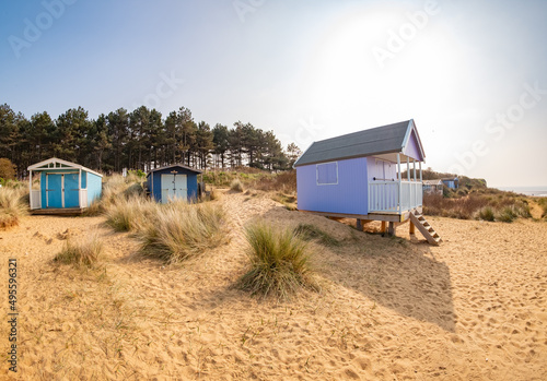 Ultra wide angle fisheye shot of traditional wooden beach huts on Hunstanton beach on the North Norfolk coast © yackers1