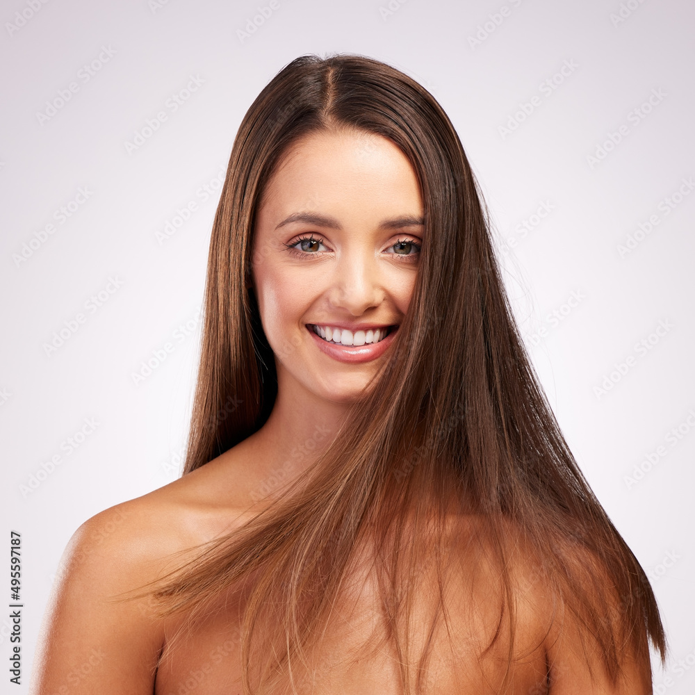 Let your hair do the talking. Studio portrait of an attractive young woman posing against a grey background. Let your hair do the talking. Studio portrait of an attractive young woman posing against a grey background.