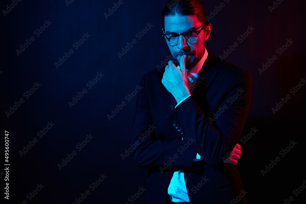 stylish man gestures with his hands with glasses isolated background