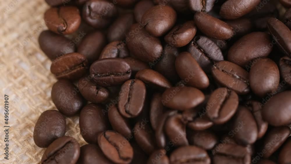 Coffee beans on canvas, close up. Rotation. 4K Coffee beans on canvas, close up. Rotation. 4K