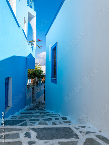 Blue and white. The sun fall on a bright blue wall and the reflection "paints" with light-blue the white wall on the opposite side. Menetes, Karpathos island, Greece. © Dimitrios