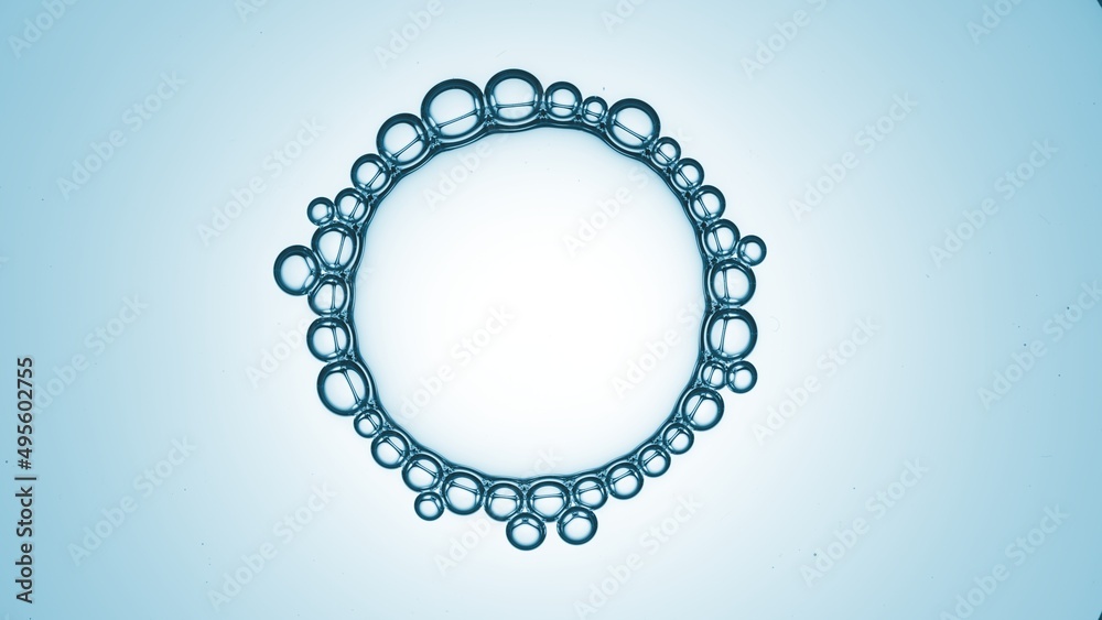 Macro shot of big transparent bubble with small ones connected around it on blue ramp background | Abstract skin care cosmetics formulating concept Macro shot of big transparent bubble with small ones connected around it on blue ramp background | Abstract skin care cosmetics formulating concept