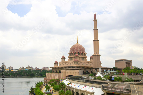 View of Putra Mosque or Masjid Putra in Putrajaya, Malaysia. Masjid Putra with its trademark pink domes is one of Putrajaya’s popular landmarks. 