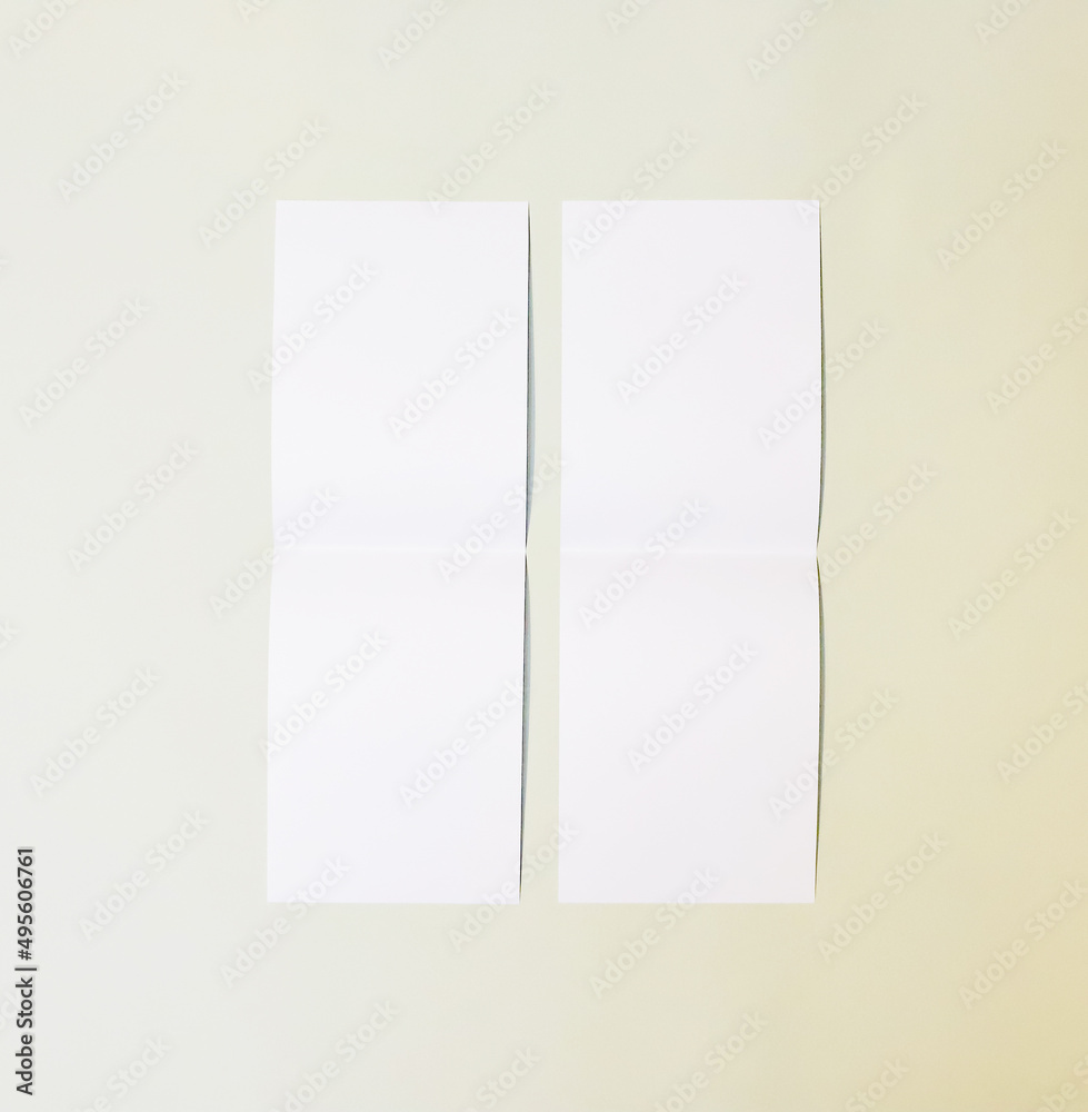 A6 A5 A4 Portrait tent fold mockup. White sheet mockup on green background.