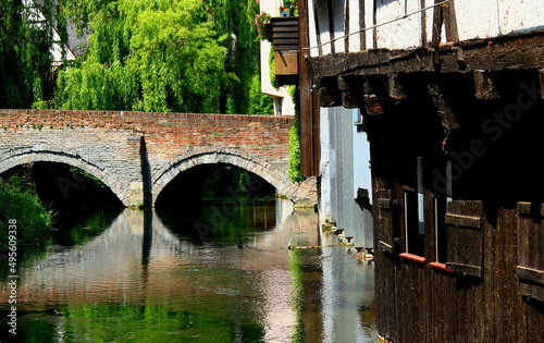 View of the stone bridge and the river on one of the small streets of Ulm (Germany)