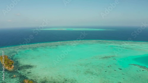 Tropical islands surrounded by an atoll and a coral reef view from above. Balabac, Philippines. Summer and travel vacation concept
