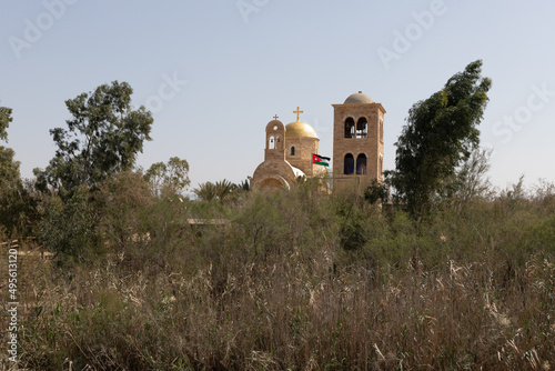 View from the Israeli side of the Jordanian part of the Holy Jordan River at the Christian site Qasr el Yahud in southern Israel, near the cities of Jerusalem and Jericho #495613120