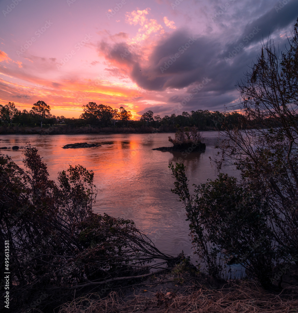 Colourful Riverside Sunset with Cloud Reflections Colourful Riverside Sunset with Cloud Reflections