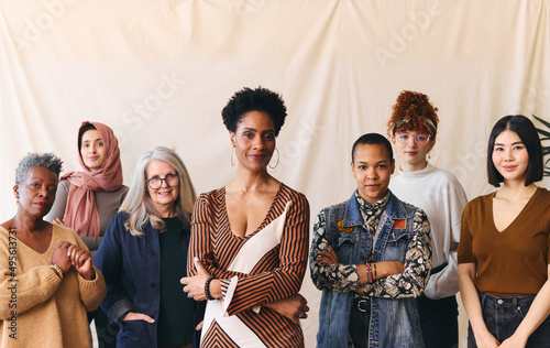 International Women's Day portrait of confident multiethnic mixed age range women looking towards camera photo