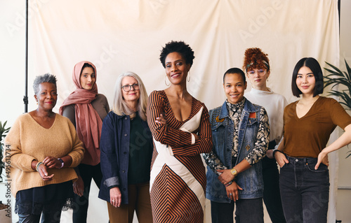 International Women's Day portrait of multiethnic mixed age range women looking confidently towards camera and smiling photo