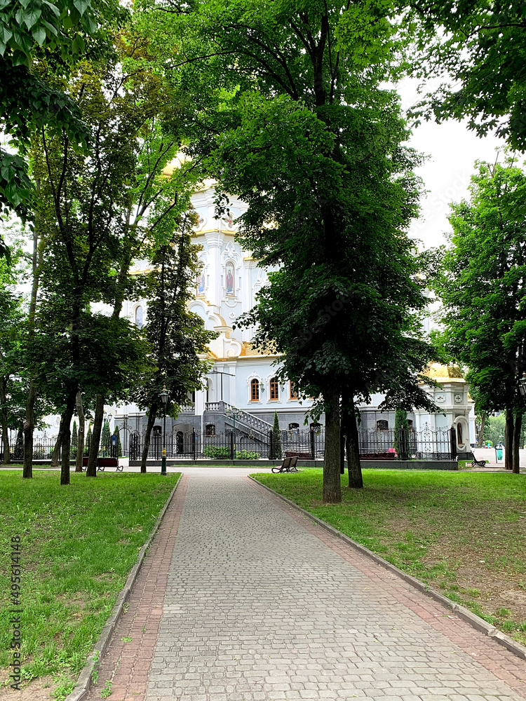 Church of the Holy Myrrh-Bearing Women in Kharkiv, Ukraine on a summer day, view through the green trees. The central part of the Kharkov city, Ukraine.