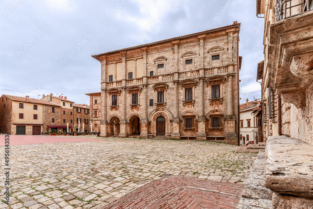 A complex of Renaissance historical buildings on the cobbled central square Piazza Grande in medieval Montepulciano town, Tuscany, Italy