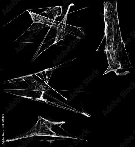 Overlay the cobweb effect. A collection of spider webs isolated on a black background. Spider web elements as decoration to the design. Halloween Props