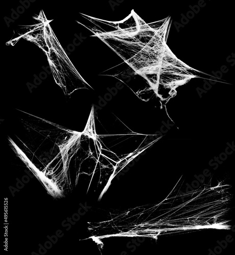 Overlay the cobweb effect. A collection of spider webs isolated on a black background. Spider web elements as decoration to the design. Halloween Props