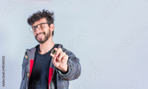 Man holding bitcoin coin, Close up of a guy holding bitcoin coin, concept of entrepreneurship and investment with bitcoin photo