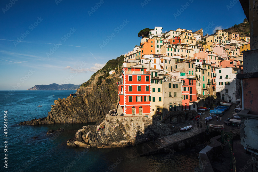 view of the town of riomaggiore by the sea in italy 