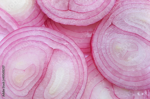 Close up of sliced shallots, full frame shot of slices shallot onions on white background.