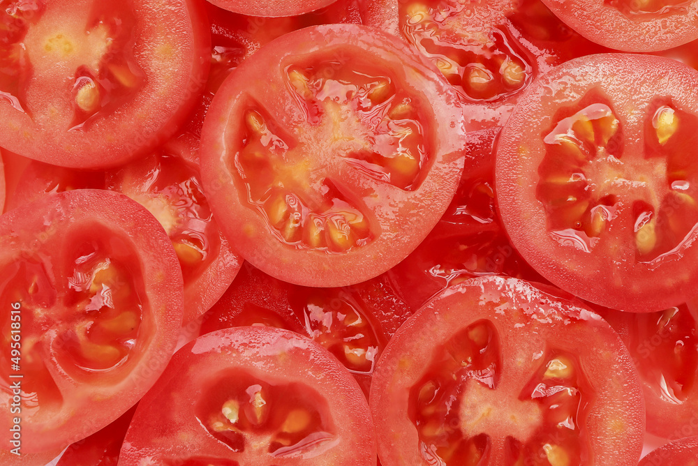 Background of sliced red ripe tomatoes. Top view. food background.