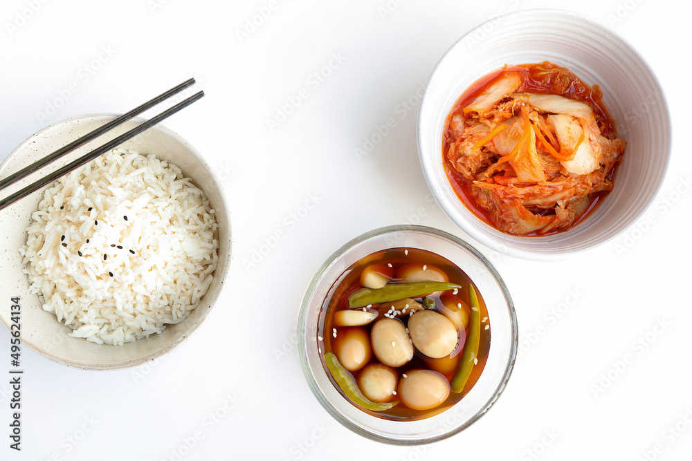 Korean braised quail eggs. Soy sauce braised quail eggs on the table served with rice and kimchi. Korean food style Korean braised quail eggs. Soy sauce braised quail eggs on the table served with rice and kimchi. Korean food style