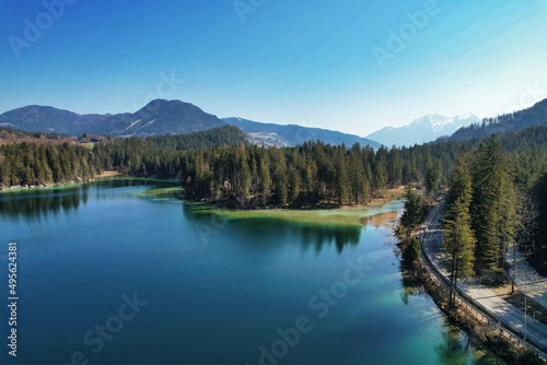 Beautiful green lake Hintersee Ramsau Berchtesgardner Land Alps surrounded by mountains and forest