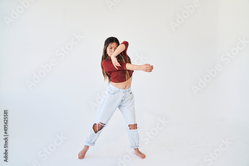 dancing woman crosses arms