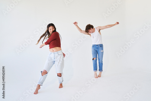 man and woman dancing in white space
