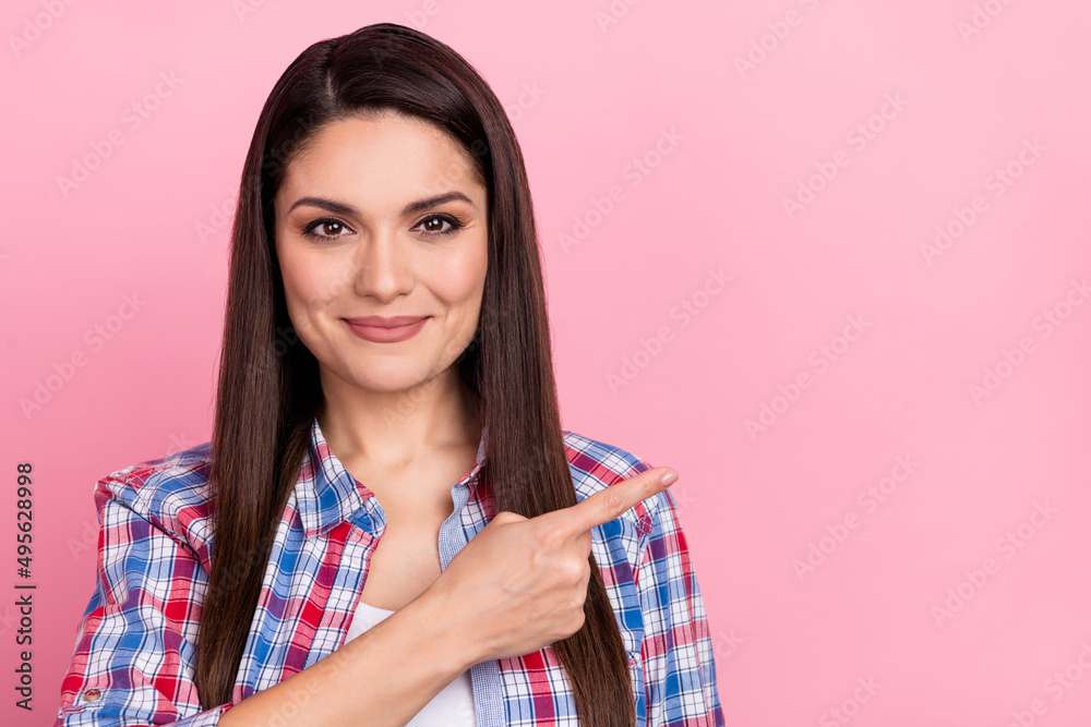 Photo of mature adorable intelligent lady promote product shopping season bargains isolated on pink color background Photo of mature adorable intelligent lady promote product shopping season bargains isolated on pink color background