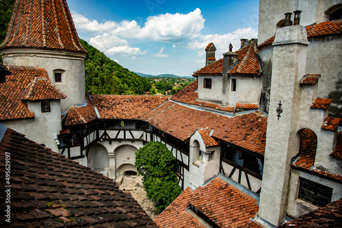 High angle shot of the interior part of Bran Castle near Brasov, Romania surrounded by forest photo