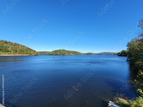 Beautiful landscape of blue lake near the dam with hills and clear sky at Croton Gorge Park, NY