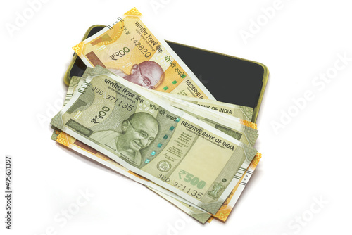 Closeup shot of 200 and 500 Indian rupees and a mobile phone isolated on a white background photo