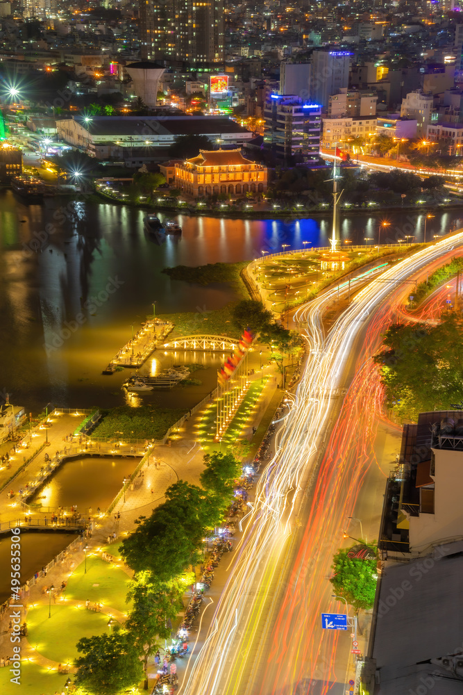 Fototapeta premium Enjoy the Nha Rong wharf and Bach Dang harbor in Ho Chi Minh City (Saigon). Colorful Saigon river at night.. Travel concept.