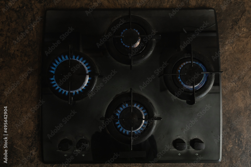 Gas burners on the stove. blue flames, view from above Gas burners on the stove. blue flames, view from above