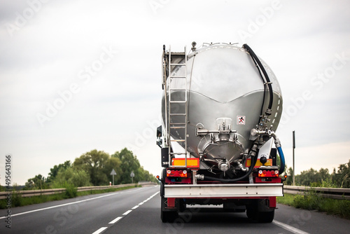 Long vehicle truck with tank trailer on a highway. photo