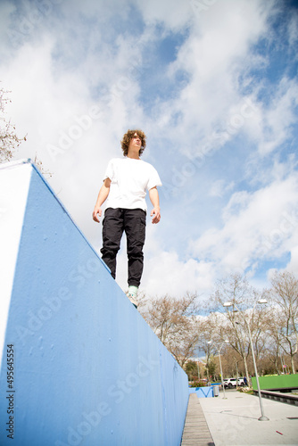 teenager on a wall looking sideways with copy space photo