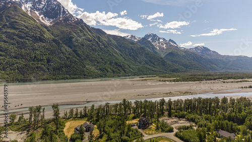 Aerial view of a summer day over the rural area near mountains in Palmer, Alaska