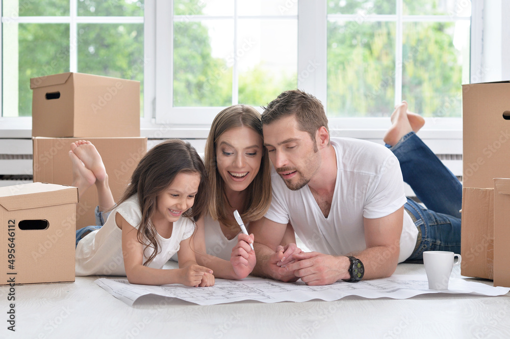 Young happy family moving into their new home Young happy family moving into their new home