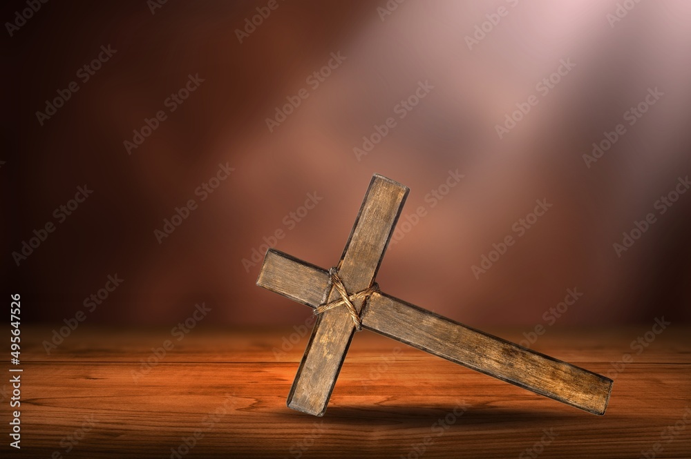 Holy and Good concepts. Wooden cross on vintage background.