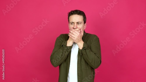 Man covering mouth with hands. Can not speak over isolated background
