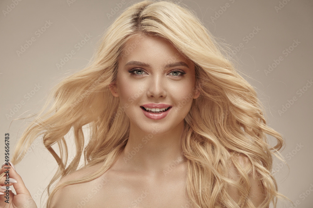 Pretty female portrait of beautiful woman with long wavy hair. Pretty female portrait of beautiful woman with long wavy hair.