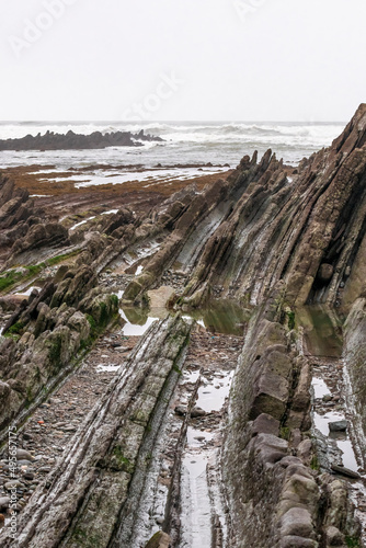 stratified rocks on the beach of sopelana in the basque country