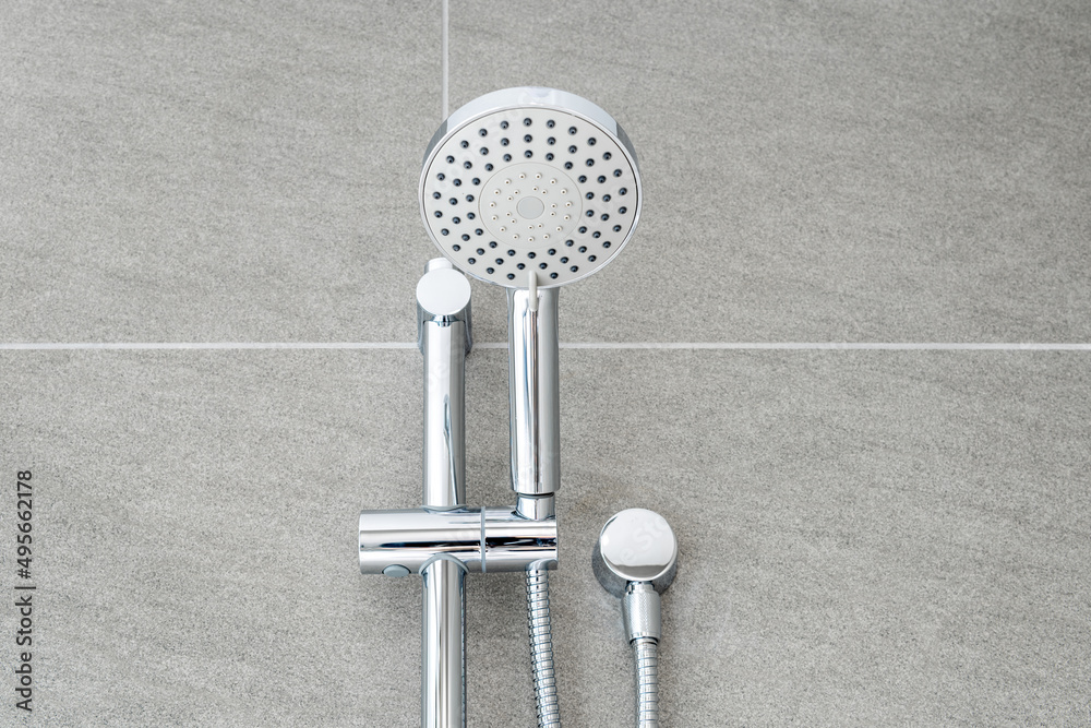 Silver shower head closeup in bathroom - obrazy, fototapety, plakaty 