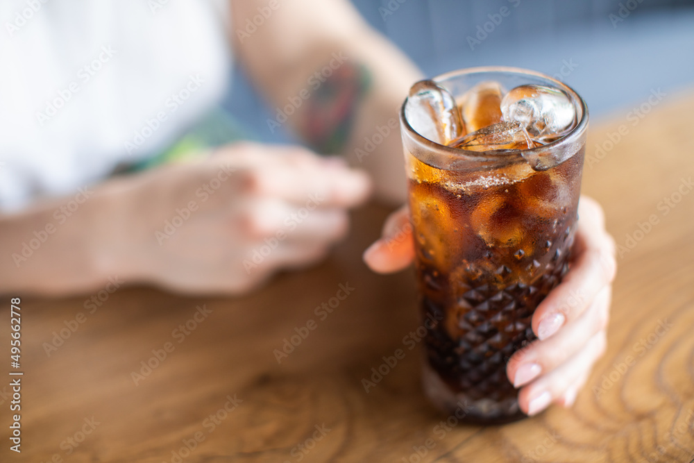 the girl drinks a delicious sweet cocktail and looks into the phone, amazing relaxing day, delicious lemonade, elegant dress in a cafe the girl drinks a delicious sweet cocktail and looks into the phone, amazing relaxing day, delicious lemonade, elegant dress in a cafe