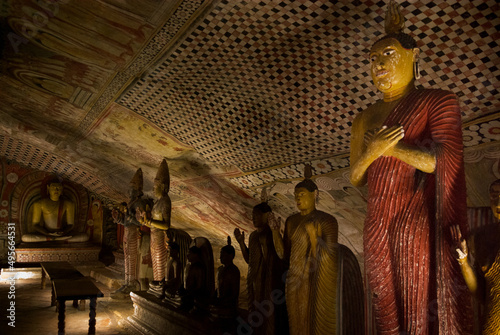 Buddha statues inside Dambulla cave teple complex photo
