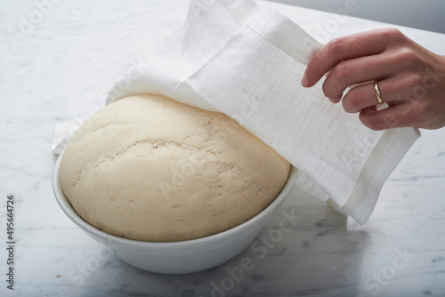 bread dough with female hand photo