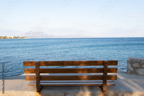 Empty wooden bench by sea.  No people. © burhan