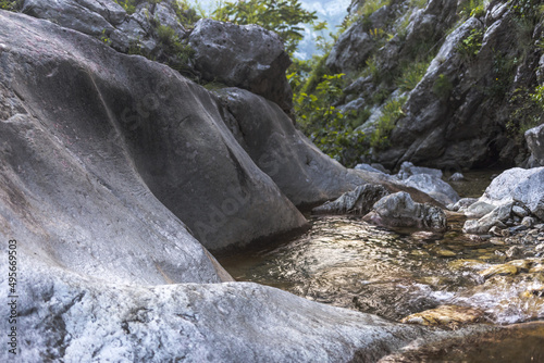 Stream of water in Skurda Canyon in Montenegro in summer photo