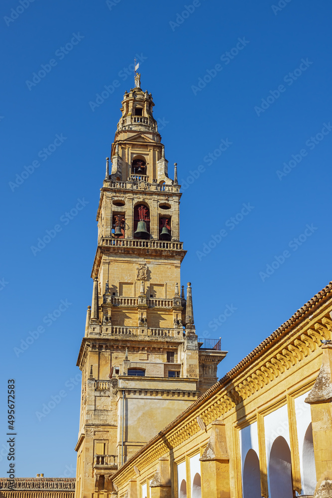 Looking up at the spire of Cordoba's cathedral, seen from the side of the building
