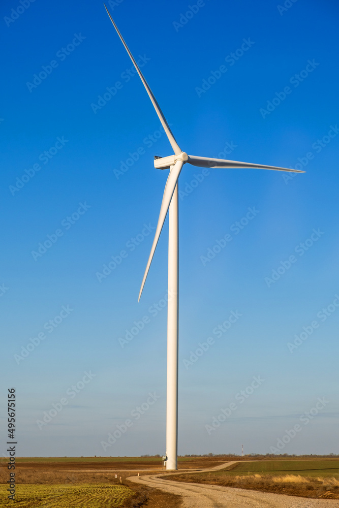 windmills in the field during the day, environmentally friendly and safe production of electricity windmills in the field during the day, environmentally friendly and safe production of electricity